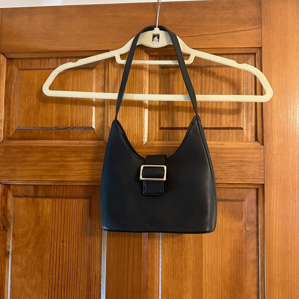 Black shoulder bag with gold clasp detail